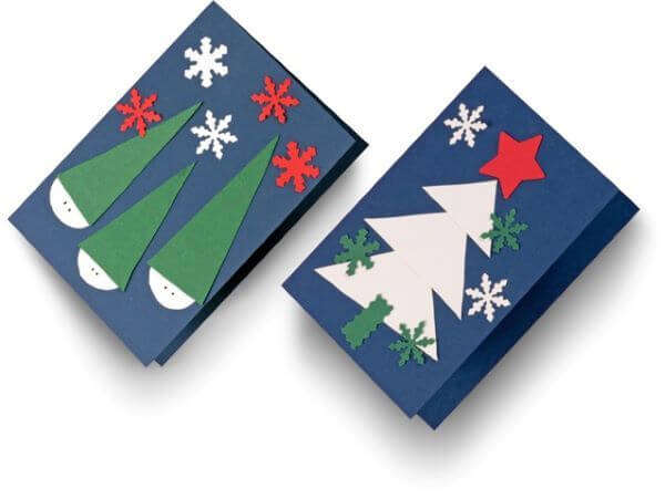 Kartki bożonarodzeniowe wykonane samodzielnie w kolorze granatowym z białą choinką i śnieżkami. druga kartka z krasnalami w zielonych czapeczkach.