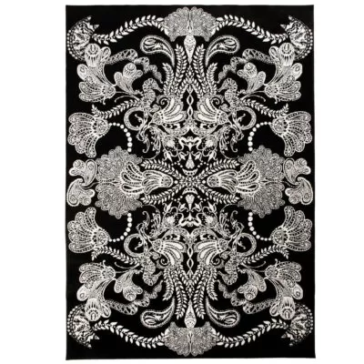 Dywan czarno biały SYVÄMERI. Dekoracyjny duży dywan 140x200 do salonu o bogatej białej ornamentyce na czarnym tle. Skandynawski design