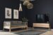 Komody do salonu w pięknej aranżacji z drewnianą sofą w minimalistycznym skandynawskim stylu.